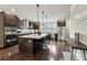 Elegant kitchen featuring a large island, stainless appliances, and sleek, dark cabinetry at 4125 Barry Pl, Chamblee, GA 30341