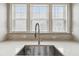 Detail shot showcasing the sink, faucet, and backsplash in the kitchen at 4125 Barry Pl, Chamblee, GA 30341