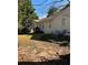 Spacious backyard with a wood patio and a table and chairs, perfect for outdoor entertaining and relaxation at 413 Remington Ct, Villa Rica, GA 30180