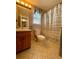 Bathroom with a tiled floor, modern vanity, and striped shower curtain at 413 Remington Ct, Villa Rica, GA 30180