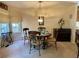 Cozy dining room bathed in natural light, featuring a round table, comfortable chairs, and elegant decor at 413 Remington Ct, Villa Rica, GA 30180