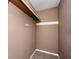 Walk-in closet with shelving and carpeted floor at 6347 Steepleridge Ct, Riverdale, GA 30296