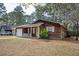 Charming home with a front porch, well-kept lawn, and an adjacent driveway at 6347 Steepleridge Ct, Riverdale, GA 30296