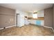 Functional kitchen featuring white cabinets, a white appliances, and vinyl floors at 6347 Steepleridge Ct, Riverdale, GA 30296