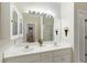 Well-lit bathroom with double sinks, large mirror, and ample storage, providing a functional and inviting space at 8005 Sweet Creek Rd, Johns Creek, GA 30097