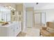 Elegant bathroom featuring white cabinets, a glass shower, and a separate bathtub, offering a spa-like experience at 8005 Sweet Creek Rd, Johns Creek, GA 30097