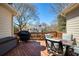 Inviting wooden deck with outdoor seating, perfect for relaxing and entertaining with a barbecue at 8005 Sweet Creek Rd, Johns Creek, GA 30097