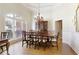 Elegant dining room with large windows and hardwood floors provides ample space for gatherings at 8005 Sweet Creek Rd, Johns Creek, GA 30097