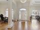 Spacious foyer with arched entryways and gleaming hardwood floors welcomes you home at 8005 Sweet Creek Rd, Johns Creek, GA 30097