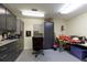 Well-organized garage featuring sleek gray cabinets and ample storage solutions at 8005 Sweet Creek Rd, Johns Creek, GA 30097