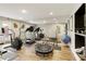 Well-equipped home gym featuring mirrors, exercise machines, weights, and plenty of workout space at 8005 Sweet Creek Rd, Johns Creek, GA 30097
