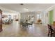 Large living room offering versatile layout options, tile flooring, and ample natural light, perfect for entertaining at 8005 Sweet Creek Rd, Johns Creek, GA 30097