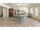 Spacious living room featuring tiled floors, neutral walls, and views to other rooms, creating an inviting space at 8005 Sweet Creek Rd, Johns Creek, GA 30097