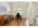 Open-concept living area featuring hardwood floors and large windows at 8005 Sweet Creek Rd, Johns Creek, GA 30097