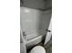 Standard tub and shower combination with white tile in the main bathroom at 309 Peachtree Dr, Riverdale, GA 30274