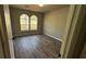 Cozy bedroom with laminate flooring and a large window letting in ample natural light at 309 Peachtree Dr, Riverdale, GA 30274