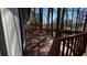 View of the deck with wooden railing, attached to the back of the home at 309 Peachtree Dr, Riverdale, GA 30274