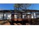Exterior view of the wooden deck off the back of this home at 309 Peachtree Dr, Riverdale, GA 30274