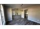 Kitchen featuring wood-look floors and white cabinets with granite countertops at 309 Peachtree Dr, Riverdale, GA 30274