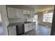 Charming kitchen with stainless steel appliances, granite countertops, and ample natural light at 309 Peachtree Dr, Riverdale, GA 30274