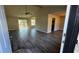 Open concept living room with high ceilings, deck access and wood-look flooring at 309 Peachtree Dr, Riverdale, GA 30274