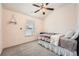 Comfortable bedroom with a ceiling fan and a serene ambiance at 636 Georgia Way, Woodstock, GA 30188