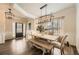 Elegant dining room with stylish light fixtures and a rustic wooden table at 636 Georgia Way, Woodstock, GA 30188