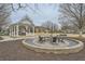 Community gazebo with a fireplace and seating, ideal for gatherings and outdoor enjoyment at 636 Georgia Way, Woodstock, GA 30188