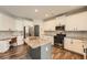 Bright kitchen with white cabinets, granite countertops, and stainless steel appliances at 636 Georgia Way, Woodstock, GA 30188