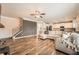 Open-concept living room with hardwood floors and plenty of natural light at 636 Georgia Way, Woodstock, GA 30188