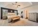 Spacious main bedroom featuring a trey ceiling, neutral carpet, and a dedicated sitting area at 636 Georgia Way, Woodstock, GA 30188