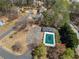 Aerial view of neighborhood pool and playground, revealing property location and community amenities at 924 Evian Nw Dr, Kennesaw, GA 30152