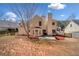 Backyard view showcases a patio, fenced yard, and mature trees at 924 Evian Nw Dr, Kennesaw, GA 30152