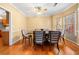 Dining room with hardwood floors and a large dining table at 924 Evian Nw Dr, Kennesaw, GA 30152