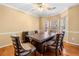 Spacious dining room with hardwood floors and comfortable seating for eight at 924 Evian Nw Dr, Kennesaw, GA 30152