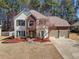 Charming two-story home with a brick facade and attached two-car garage at 924 Evian Nw Dr, Kennesaw, GA 30152