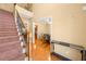 Open foyer with hardwood floors, staircase and view into the dining room at 924 Evian Nw Dr, Kennesaw, GA 30152