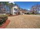 Well-maintained lawn and landscaped garden beds accentuates the home's curb appeal at 924 Evian Nw Dr, Kennesaw, GA 30152