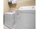 Functional laundry room with a washer and dryer for convenient laundry tasks at 924 Evian Nw Dr, Kennesaw, GA 30152