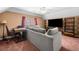 Comfortable living room features a large sectional sofa, desk, and TV at 924 Evian Nw Dr, Kennesaw, GA 30152