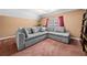 Comfortable living room with a large sectional sofa and neutral decor at 924 Evian Nw Dr, Kennesaw, GA 30152