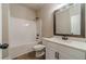 This bathroom features a shower-tub combo, quartz countertop, and modern fixtures at 167 Pinewood Dr, Covington, GA 30014