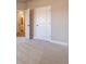 Bedroom featuring neutral carpeting and a door leading to an ensuite bathroom at 167 Pinewood Dr, Covington, GA 30014