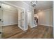 Welcoming foyer with hardwood floors, a study, and staircase leading to the second level at 167 Pinewood Dr, Covington, GA 30014