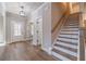 Spacious foyer with natural light, hardwood floors, and stairs to the upper level at 167 Pinewood Dr, Covington, GA 30014
