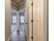 Hallway featuring hardwood floors and white doors leading to other rooms at 167 Pinewood Dr, Covington, GA 30014