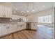 Bright kitchen with white cabinets, stainless steel appliances, and wood-look flooring at 167 Pinewood Dr, Covington, GA 30014