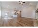 Spacious living room with open floor plan, hardwood floors, and view to kitchen at 167 Pinewood Dr, Covington, GA 30014