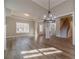 Bright and airy living room with hardwood floors, elegant lighting, and a view of the outdoors at 167 Pinewood Dr, Covington, GA 30014