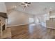 Vaulted living room with wood-look flooring and a brick fireplace at 167 Pinewood Dr, Covington, GA 30014